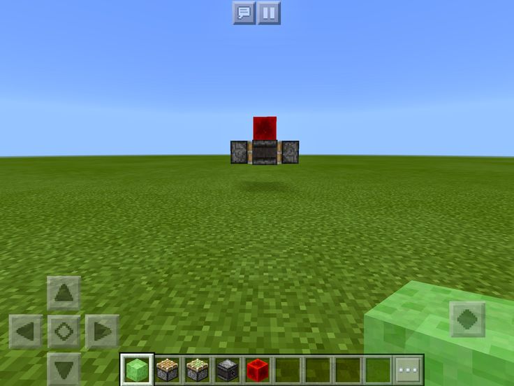 an image of a computer game with blocks in the middle and grass on the other side