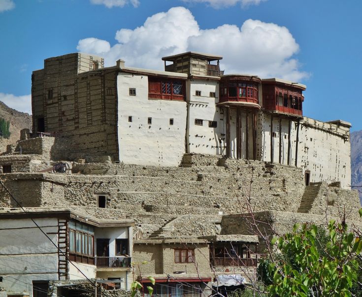 an old building with many windows on top of it