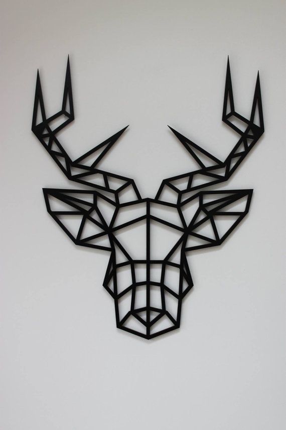 a deer head made out of black paper on a white background with the word,