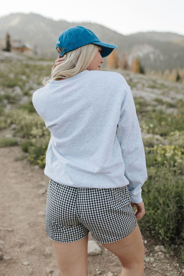 Go for a winning look with THE 98 SWEATSHIRT IN ASH. The oversized fit and grey fabric provide ultimate comfort, while the bold 98 graphic and red numbers give off a cool and sporty vibe. Perfect for both athletic and chic styles. Paired with THE MADA BOXER SHORTS IN BLACK AND WHITE GINGHAM and THE LOS ANGELES BASEBALL HAT IN ROYAL BLUE Oversized fit 98 graphic printed Premium cotton Unisex sizing 100% cotton Oversized fit. Small/Medium (0-6), Medium/Large (6-12) Model is 5'5" wearing a size sma Relaxed Fit Sweatshirt For Sports Events In Fall, Sporty Sweats With Graphic Print And Relaxed Fit, Gray Crew Sweats With Ribbed Cuffs, Heather Grey Fleece Sweatshirt Relaxed Fit, Heather Grey Relaxed Fit Fleece Sweatshirt, Casual Fall Activewear For Sports Events, Casual Activewear For Fall Sports Events, Crew Neck Athleisure Sweatshirt For Sports Events, Gray Sporty Sweatshirt For Loungewear