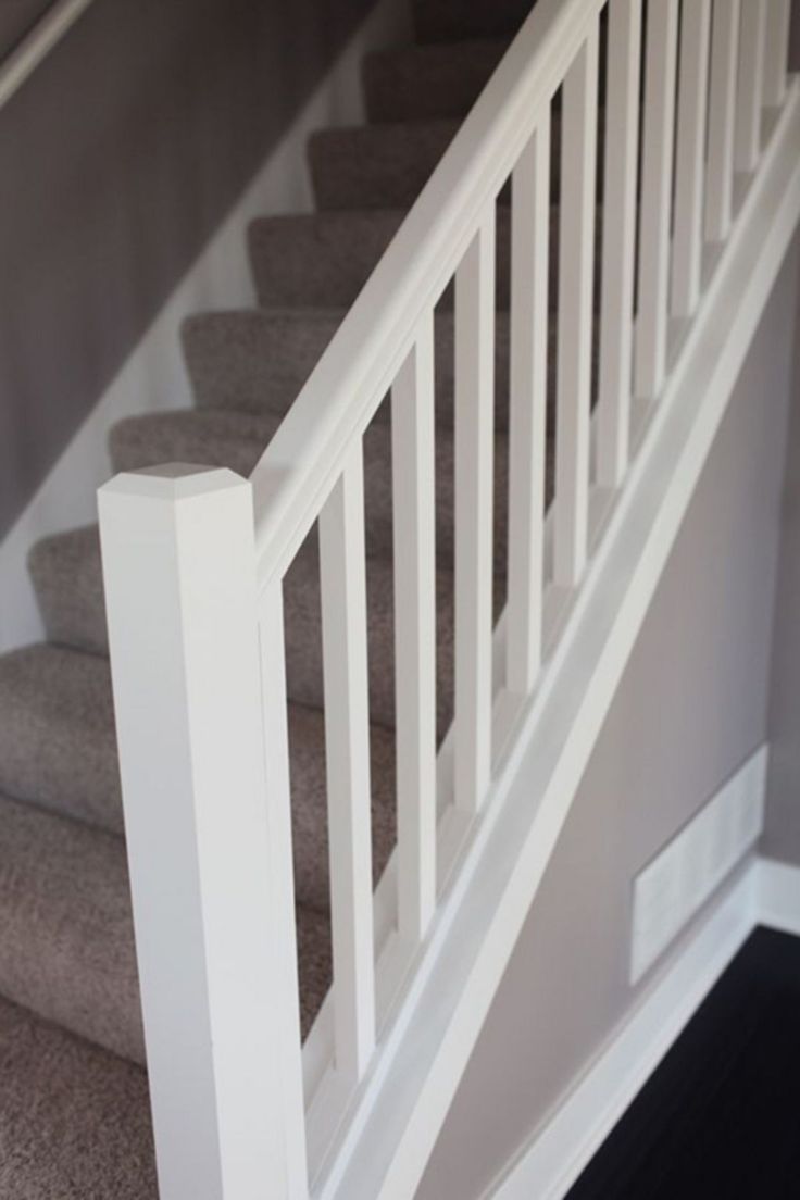 the stairs are painted white and there is carpet on the floor next to each other