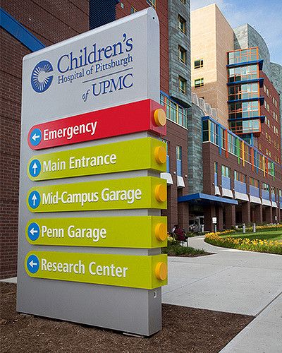 the sign for children's hospital of utic is in front of some buildings