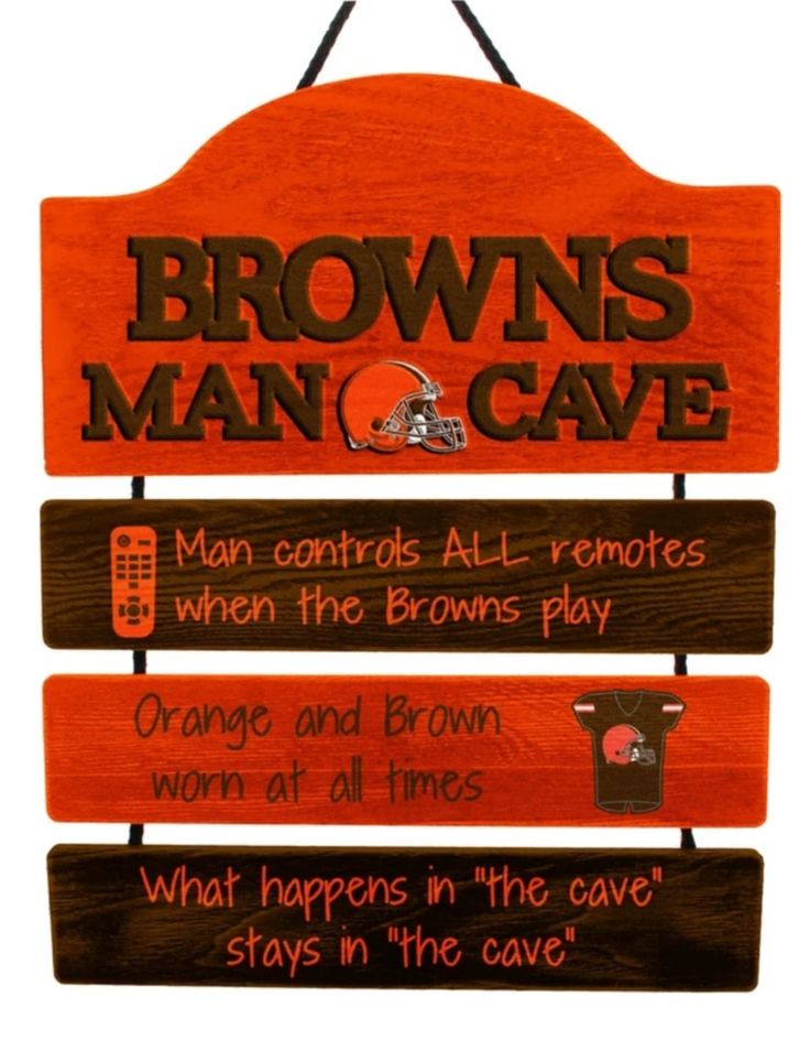 a wooden sign that says browns man cave with three different signs hanging from it's sides