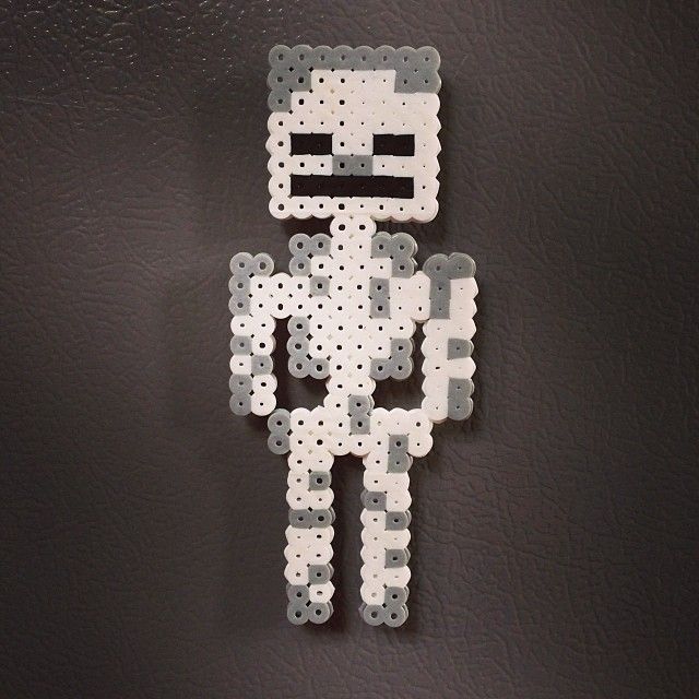 an image of a pixel man made out of legos