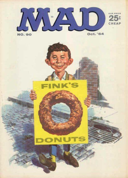 the cover of mad magazine shows a young boy holding a sign that reads fink's donuts