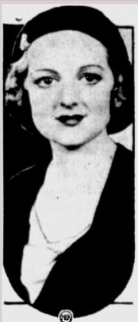 an old black and white photo of a woman wearing a hat with her hair in a bun