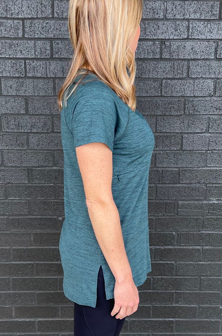 Finally a loose-fitting, short sleeve workout top with a nursing opening that's hidden! Moisture-wicking, V-neck, long length, and super flattering! This 2.0 version has a new softer fabric! NURSING ACCESS: this t-shirt has a horizontal nursing zipper - one long zipper with zipper pulls on both sides. FIT: Fits true to size FABRIC: 92% polyester, 8% spandex MODELS:Quinn is 5'1, a size XS (2), 34C and is wearing a size XS.Denita is 5'5, a size M/L (10/12) and 34 DDD/F and sized down to a medium.J Fit Nurse, Workout Tshirts, Zipper Pulls, Maternity Wear, Baby Size, Deep Sea, Long Length, Workout Tops, Size 20