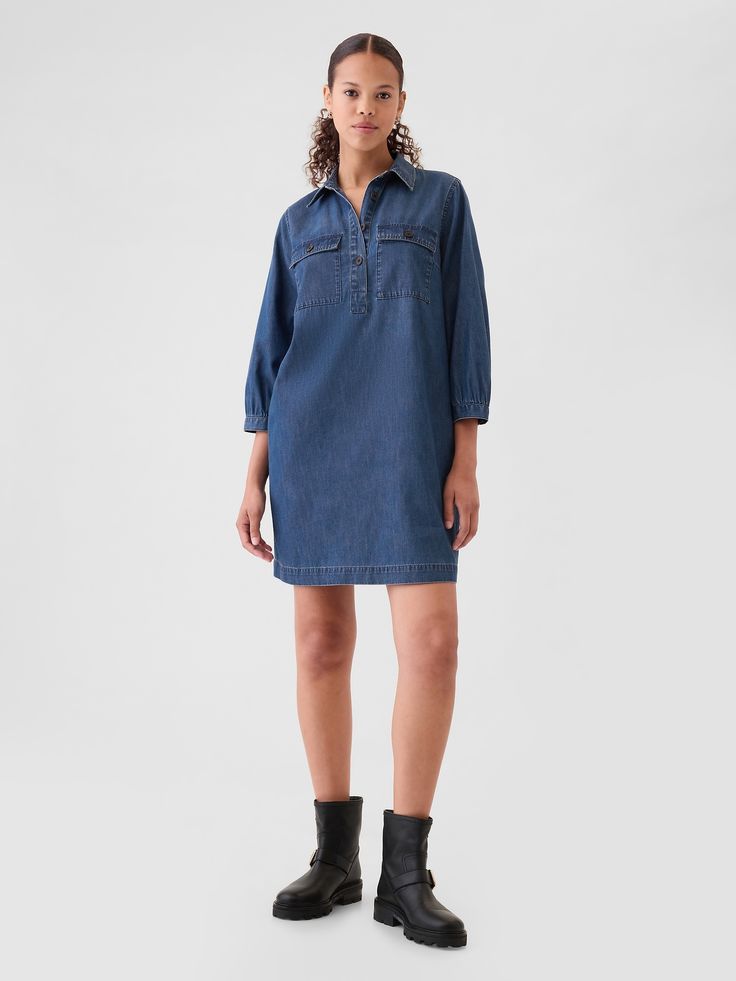 Soft denim pullover mini shirtdress.  Point collar, quarter button closure.  3/4 sleeves with button cuffs.  Button-flap utility pockets at chest.  Responsibly Made: This denim dress is part of our water-saving Washwell program.  Compared with conventional wash methods, Washwell uses at least 20% less water and has saved over a billion liters of water since 2016.  Fit: Relaxed.  A shift silhouette with a relaxed & easy fit throughout.  For a Classic fit, go down one Denim Pullover, Utility Pockets, Water Saving, Dress Inspo, Dark Indigo, Gap Denim, Shirtdress, Workwear Dress, Denim Dress