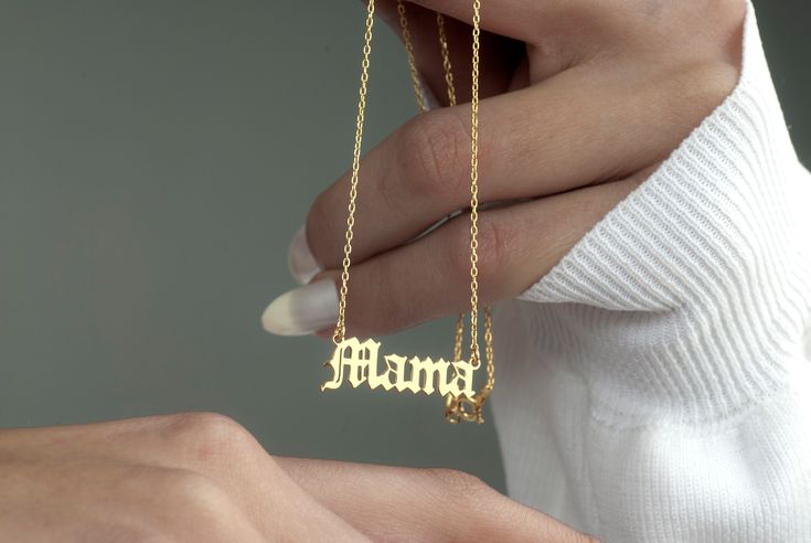 🌟 Welcome to Shimmer&Shine By Asya! 🌟 Embrace the essence of motherhood with our personalized Mama Name Necklace, a unique and heartfelt piece designed to celebrate the unconditional love of mothers everywhere. ✨ Customized Just for You: Crafted in 925 Sterling Silver, 8K Solid Gold, 14K Solid Gold Silver on 14k gold plating, our Mama Name Necklace features a captivating gothic-style design, showcasing the name "Mama" in a font of your choice. Personalize it further by selecting the perfect fo Gold Name Jewelry For Mom, Gold Jewelry With Name For Mom, Customized Name Necklace For Mom, 14k Gold Name Necklace As Gift For Mom, Dainty Custom Necklace With Name For Mother's Day, Customized Dainty 14k Gold Jewelry, Dainty Customized Jewelry As Gift For Mom, Dainty Customized Jewelry Gift For Mom, Customized Dainty Jewelry For Mom