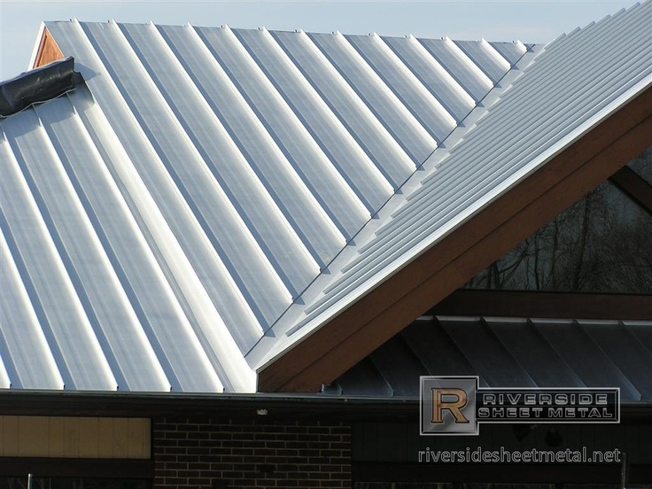 the roof of a building with metal shingles on it