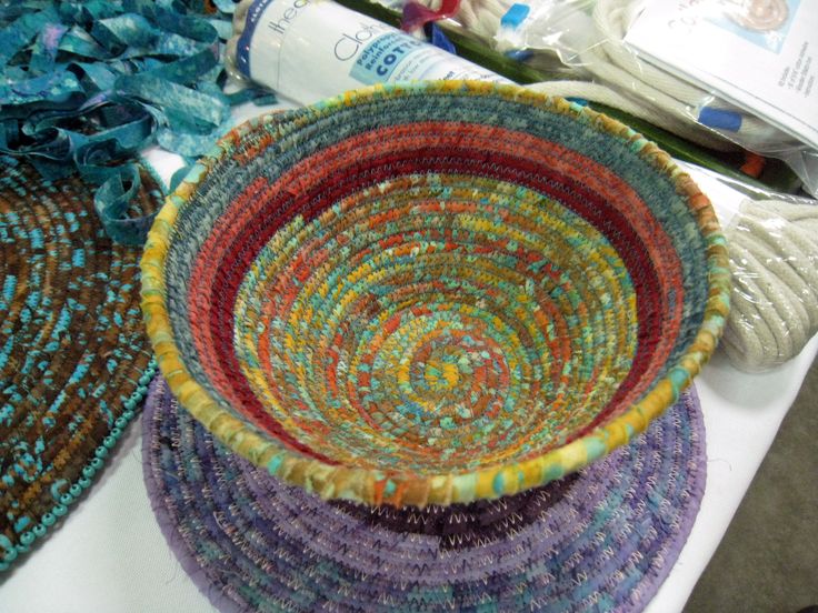 three baskets sitting on top of a white table