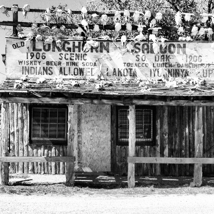 an old building with many signs on it