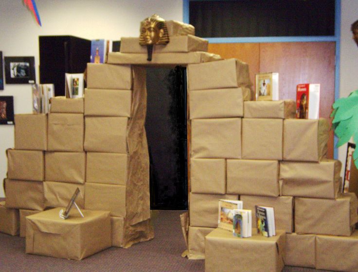 cardboard boxes stacked on top of each other in an office