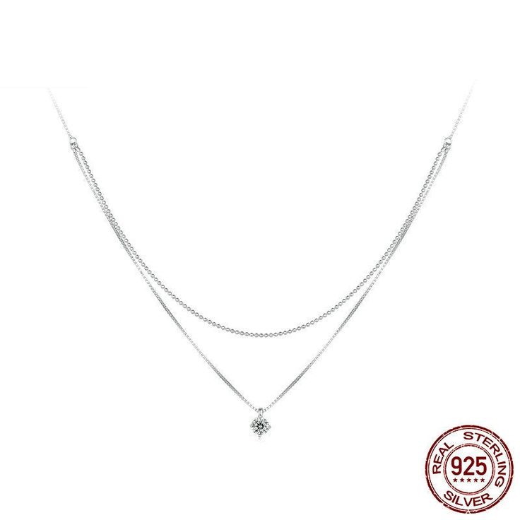 Legara V-Neck Layer Necklace is a charming spin on a standard layer or pendant necklace. The platinum plating over 925 sterling silver makes this necklace hypoallergenic, waterproof, and tarnish resistant. Pendant: 925 silver with gorgeous high-grade inlaid cubic zirconia designed to look just like a real diamond. Chain style: Box chain and ball chain combo is unique and elegant. Silver Cubic Zirconia Charm Necklaces, Tarnish Resistant, Fine Jewelry Silver Necklaces For Layering, White Gold Sterling Silver Necklace For Layering, Silver Tarnish Resistant Charm Necklaces With Cubic Zirconia, Fine Jewelry Silver Double Strand Necklace, Silver Tarnish Resistant Fine Diamond Necklace, Silver Tarnish-resistant Fine Jewelry Diamond Necklace, Silver Tarnish Resistant Charm Necklace For Layering, Silver Tarnish-resistant Charm Necklace For Layering