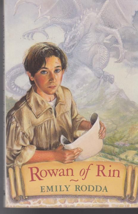 the cover of rowan of rin, with an image of a boy holding a piece of paper