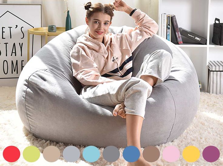 a woman sitting on a bean bag chair