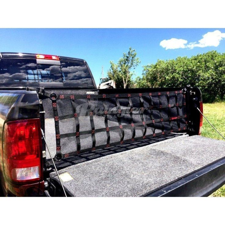 the back end of a pickup truck with its bed up