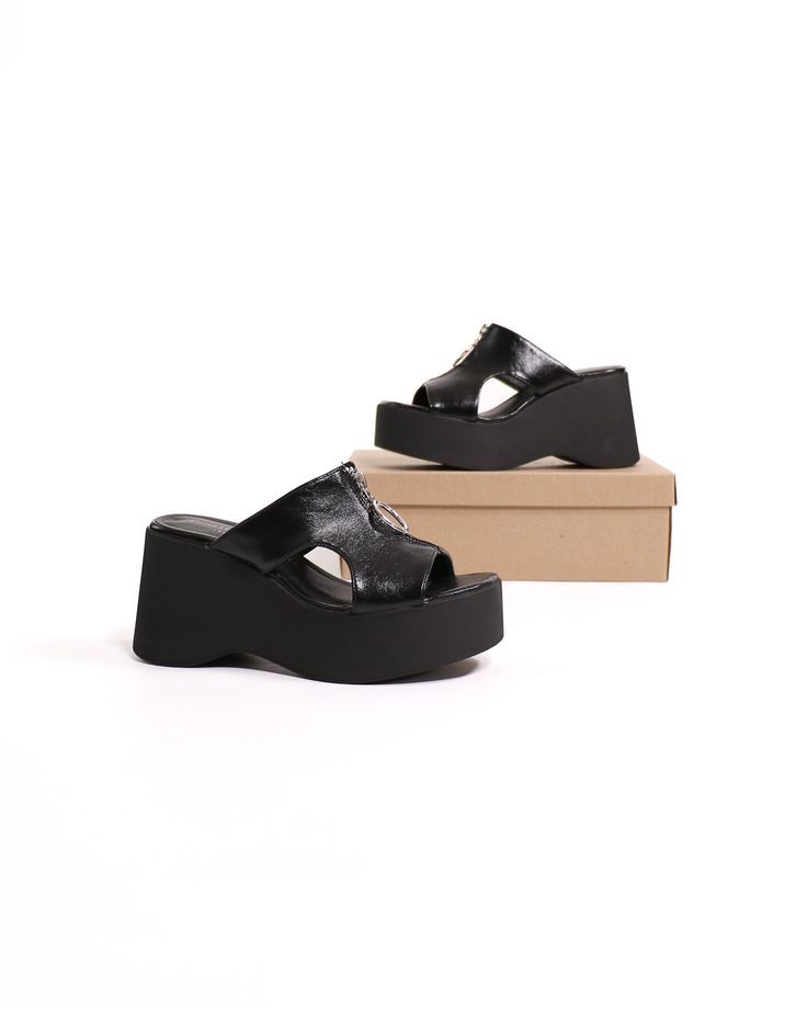 The Zip-Hop Platform Sandal is the perfect shoe for the fashion-forward woman who wants a stylish and comfortable shoe. The 3.5-inch platform wedge heel is modern and sexy, while the slip-on entry makes it easy to wear. The lightly padded footbed ensures hours of comfort, and the zipper detailing on the upper adds a touch of edgy appeal. Best of all, the Zip-Hop Platform Sandal is lightweight! Manmade Materials l 3.5" Platform Wedge l True to Size Platform Wedge Heels, Chinese Laundry, Platform Wedge, Perfect Shoes, Zipper Detail, Platform Wedges, Shoe Box, The 3, Black Sandals