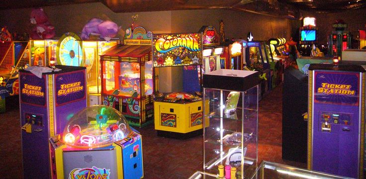 an arcade filled with lots of colorful machines