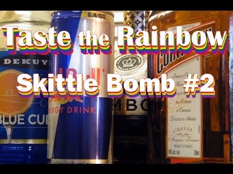 the words taste the rainbow are in front of various types of bottles and liquors