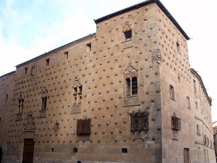 an old stone building with many windows