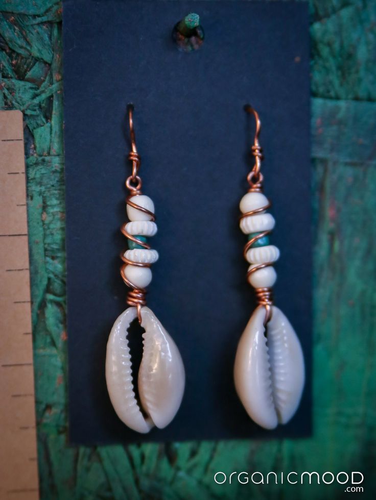 Indigenous cultures and the natural world inspire the handmade jewelry of Organic Mood Earthen Accessories. The work featured creatively emulates nature, incorporates portions of nature, and/or protects nature by utilizing repurposed and found materials. Bohemian Shell Earrings For Gift, Unique Beach Drop Earrings, Unique Beach Style Drop Earrings, Handmade Earthy Earrings For Festival, Bohemian Hand Wrapped Drop Earrings, Handmade Natural Shell Jewelry, Handmade Shell Jewelry In Natural Color, Natural Color Spiritual Jewelry For Beach, Natural Spiritual Beach Jewelry