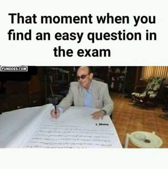 a man sitting at a table with a large sheet of paper in front of him that says, that moment when you find an easy question in the exam