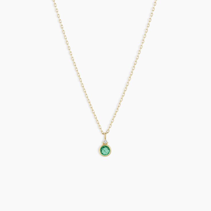 A modern heirloom. Introducing our take on a traditional style. Whether you wear yours or a loved one’s, a birthstone necklace is an easy way to add color and meaning to your look. This birthstone necklace features a 14k gold chain and diamond detail and makes for a perfect, personal gift. Emerald is May's birthstone. Product Details Diamond: 0.01 total carat weight, 1.3 mm GH SI1-SI3 Emerald: 0.15 total carat weight, 3 mm genuine emerald 14k solid gold 16" chain + 2" extender. Adjustable in 1" Dainty Round Stackable Necklaces, 14k Gold Filled Jewelry With Gemstone Accents, Dainty 14k Gold Round Pendant Jewelry, Dainty 14k Gold Round Pendant, Classic May Birthstone Jewelry, Tarnish Resistant, Classic May Birthstone Jewelry Tarnish Resistant, Everyday Fine Jewelry Green Necklaces, Classic May Birthstone Jewelry, Green Fine Jewelry Necklace For Everyday