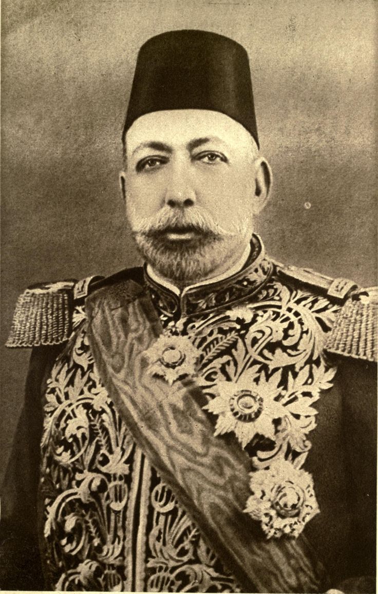 an old black and white photo of a man in uniform