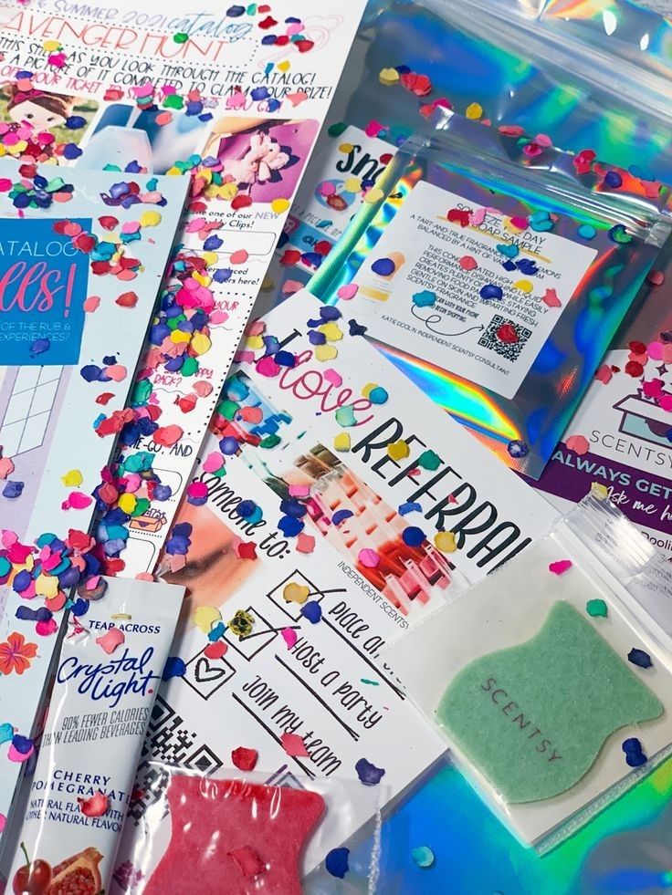 several different types of confetti and stickers in plastic bags on top of each other