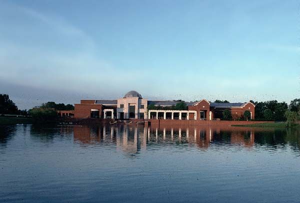 a large building sitting on top of a lake