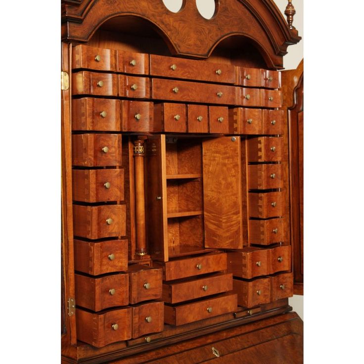 an old wooden cabinet with many drawers