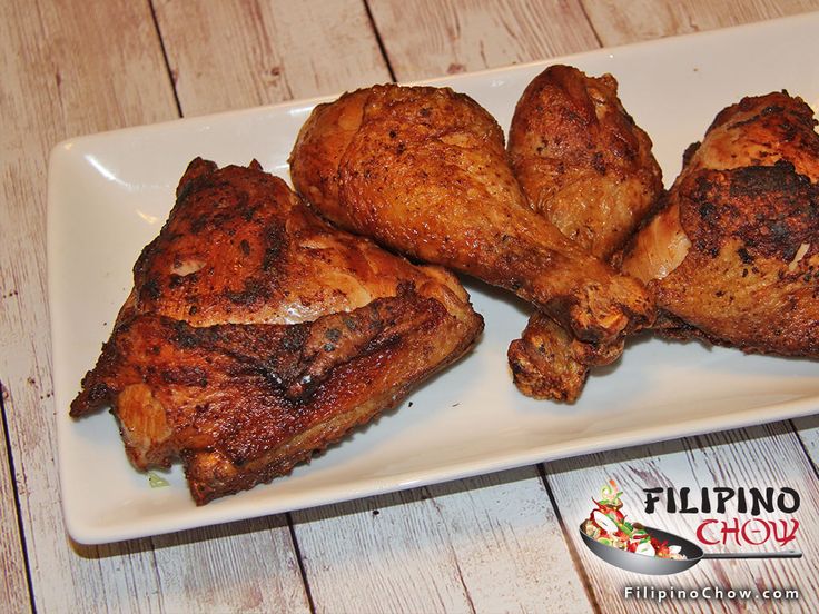 four pieces of chicken on a white plate