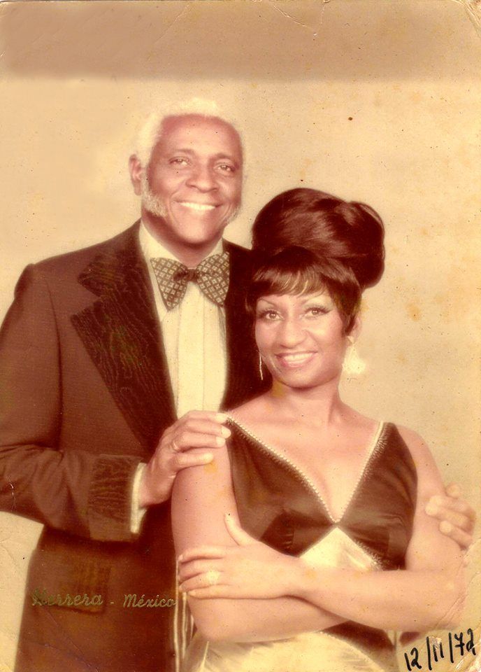 an old photo of a man and woman posing for a picture in formal dress clothes