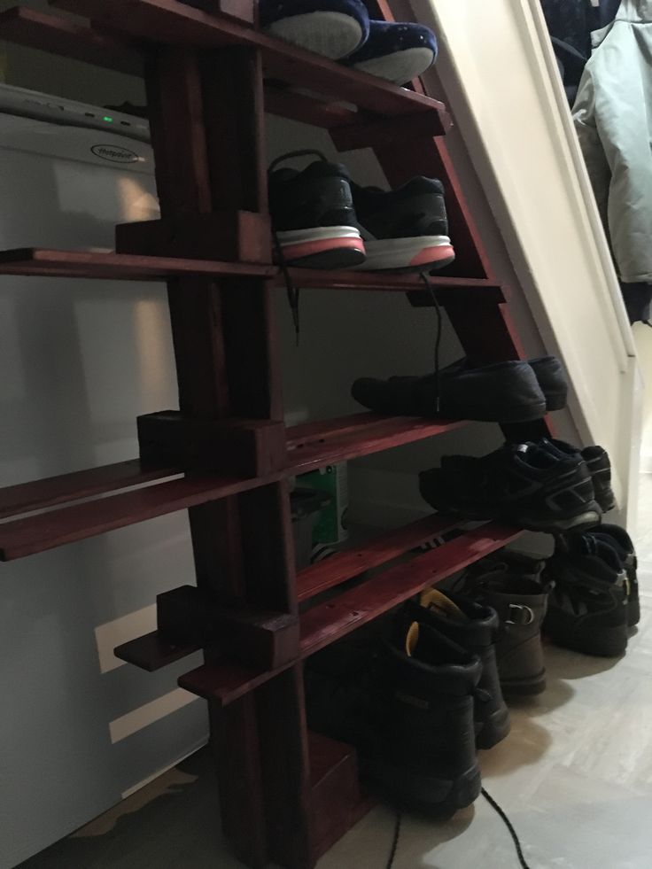 there are many pairs of shoes on the shelf