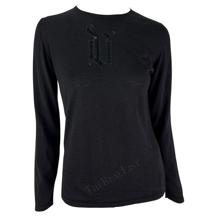 Presenting a fabulous black long sleeve Gianni Versace sweater, designed by Donatella Versace. From the Fall/Winter 2002 collection, this soft sweater features a sequin Versace monogram 'V' on the front. Add this vintage Versace monogram piece to your collection. Approximate measurements: Size - IT42 / US6 Bust: 36" - 40" Waist: 34" - 38" Shoulder to cuff: 23" Underarm to cuff: 17" Versace Sweater, Versace Couture, Versace Brand, Sleeveless Knit Top, Vintage Versace, Donatella Versace, S Monogram, Cindy Crawford, Soft Sweater