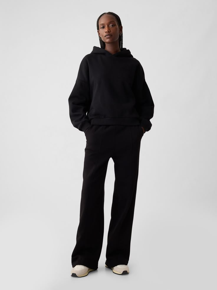 Soft fleece knit wide-leg sweatpants.  Elasticized waist.  Front slant pockets.  Seam at front.  Mid rise.  Straight silhouette with a relaxed fit.  Wide leg.  Models wearing Gap Wide Leg Sweat Set, Affordable Wide-leg Sweatpants For Lounging, Loungewear Black Women, Black Relaxed Fit Wide Leg Sweatpants, Black Sweat Set, Wide Leg Sweats Outfit, Black Wide Leg Sweatpants With Pockets, Comfortable Black Wide-leg Sweatpants, Cozy Black Sweats For Streetwear