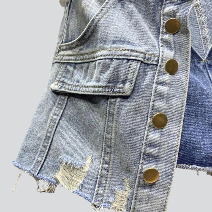 Introducing the 2023 Summer Collection's distressed hem buttoned denim skort. a grunge-inspired masterpiece perfect for the modern fashionista!Why You'll Fall In LoveThis skort is a unique combination of vintage-inspired grunge and urban flair. tailored to fit comfortably and stylishly. Its mid-waist rise. distressed hem. and buttoned closure all come together to create a timeless look that will take you from day to night with ease.Unmissable Highlights: Grunge-Inspired: Tap into the grungy vibe Frayed Hem Denim Jean Shorts For Fall, Denim Jean Shorts With Frayed Hem For Fall, Fall Distressed Denim Jean Shorts, Chic Denim Jean Shorts For Fall, Fall Denim Cutoff Jean Shorts, Medium Wash Denim Jean Shorts For Fall, Summer Denim Jacket With Frayed Hem And Button-up, Trendy Frayed Hem Jean Shorts For Fall, Trendy Distressed Jean Shorts For Fall