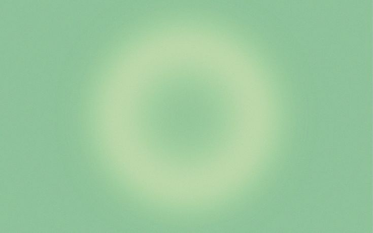 an image of a green circle in the sky