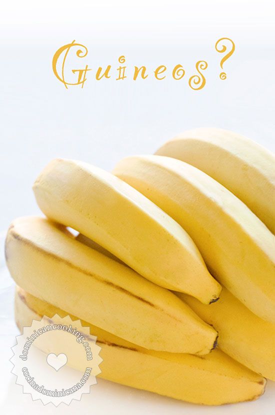 a bunch of ripe bananas sitting on top of a table next to a white background