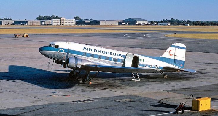 an airplane is parked on the tarmac at an airport