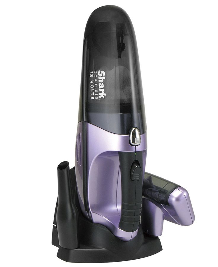 a purple and black hair dryer sitting on top of a stand