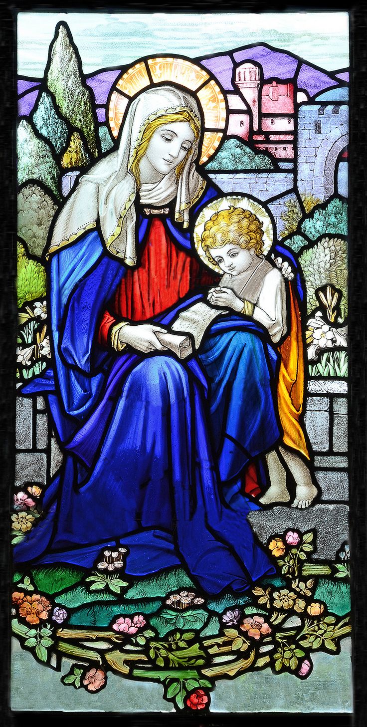 a stained glass window depicting the virgin and child