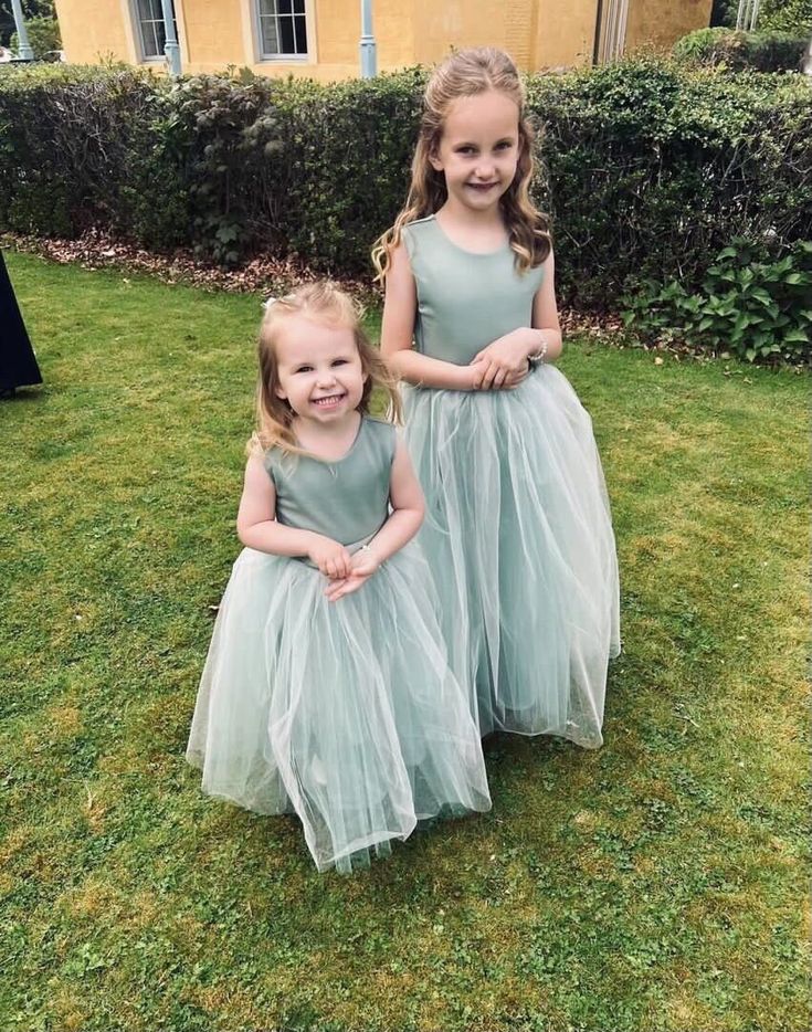 A beautiful handmade dress, perfect for flower girls, birthday, christenings, holy communion and any special occasions.  This tulle dress is designed and handmade in our UK studio (Worcester).  The dress is made from a soft stretch scuba and has layers of sparkly tulle over the skirt. The perfect princess dress! The back can have either a closed scoop back or heart cut out and is fastened together with a hook and eye. If you would like it without the heart please pop in the notes to seller when Princess Style Tulle Tutu Dress For First Communion, Tulle Princess Dress For Confirmation, Princess Style Tulle Tutu Dress For Confirmation, Princess Style Tutu Dress For Confirmation With Tulle Skirt, Green Princess Dress For Bridesmaids, Spring Confirmation Princess Dress With Tulle Skirt, Spring Princess Tulle Bridesmaid Dress, Princess Style Green Bridesmaid Dresses, Princess Style Tulle Bridesmaid Dress For First Communion