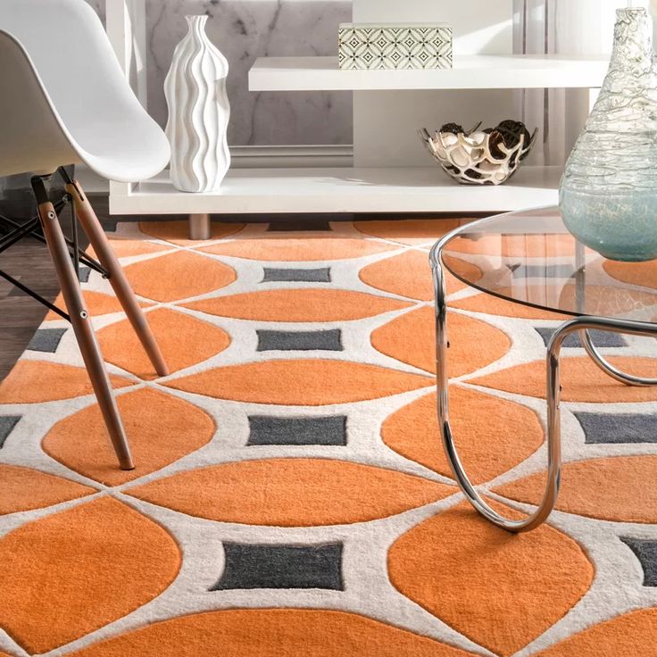 a modern living room with yellow and gray rugs