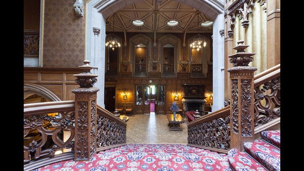 the inside of a building with ornate wooden railings