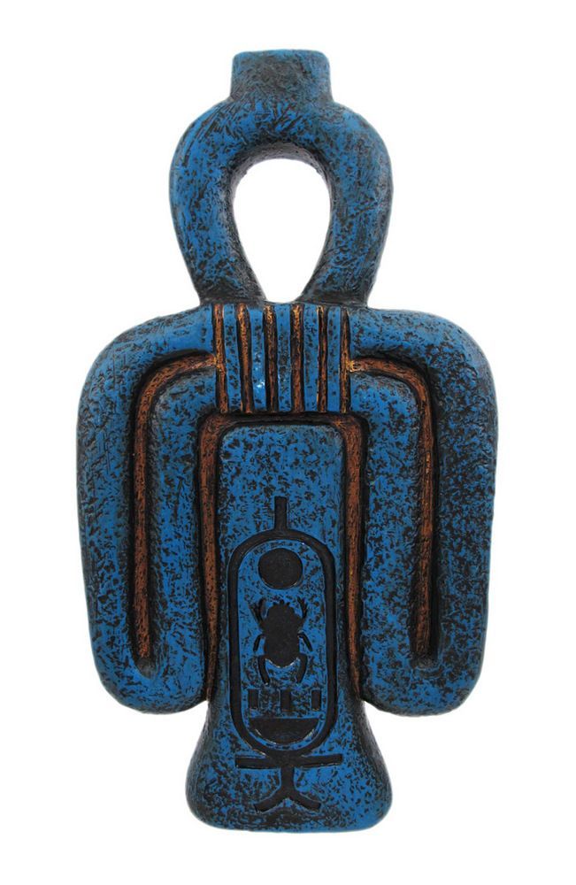 a blue and brown sculpture with two handles on it's sides, one holding a bottle