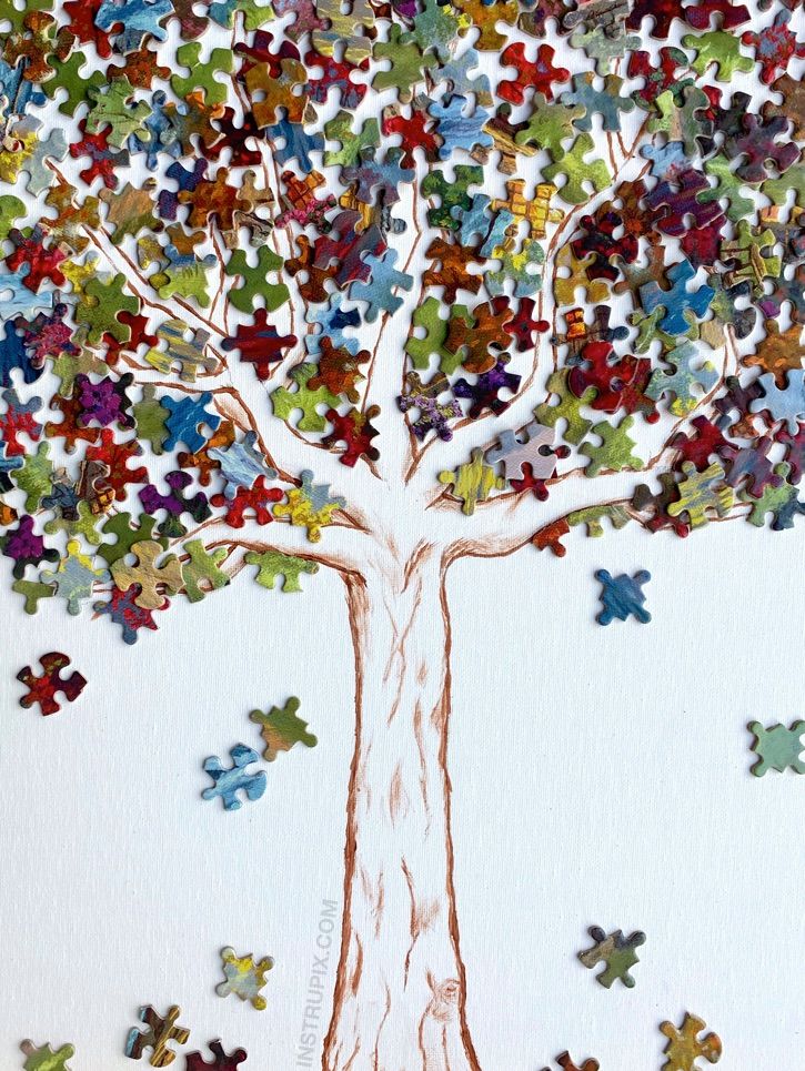 a painting of a tree made out of puzzles