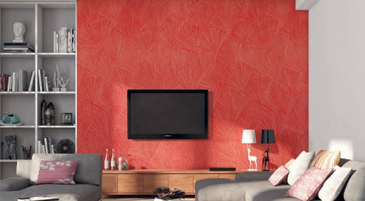 a living room with two couches and a flat screen tv mounted on the wall