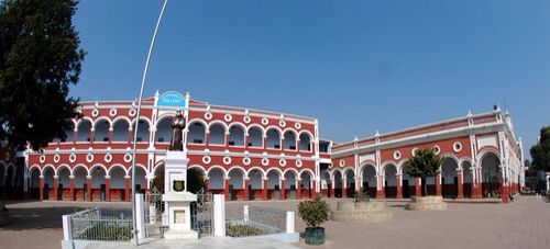 a red and white building with lots of windows